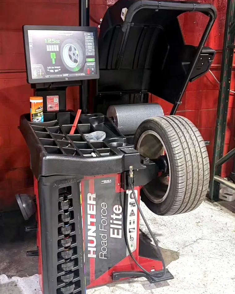 The Hunter Road Force Elite balancer in the Taylor Tire shop, mid-job on a wheel